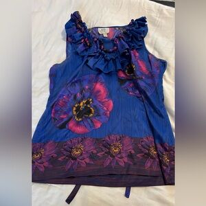 Cute blouse w/beaded neck and tie in back if you want it more fitted.Super cute